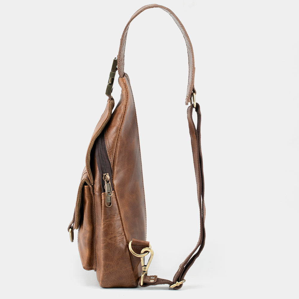 brown leather sling backpack American Bison in Cocoa gift wrap with ribbon. Rugged Earth Full Grain Sling