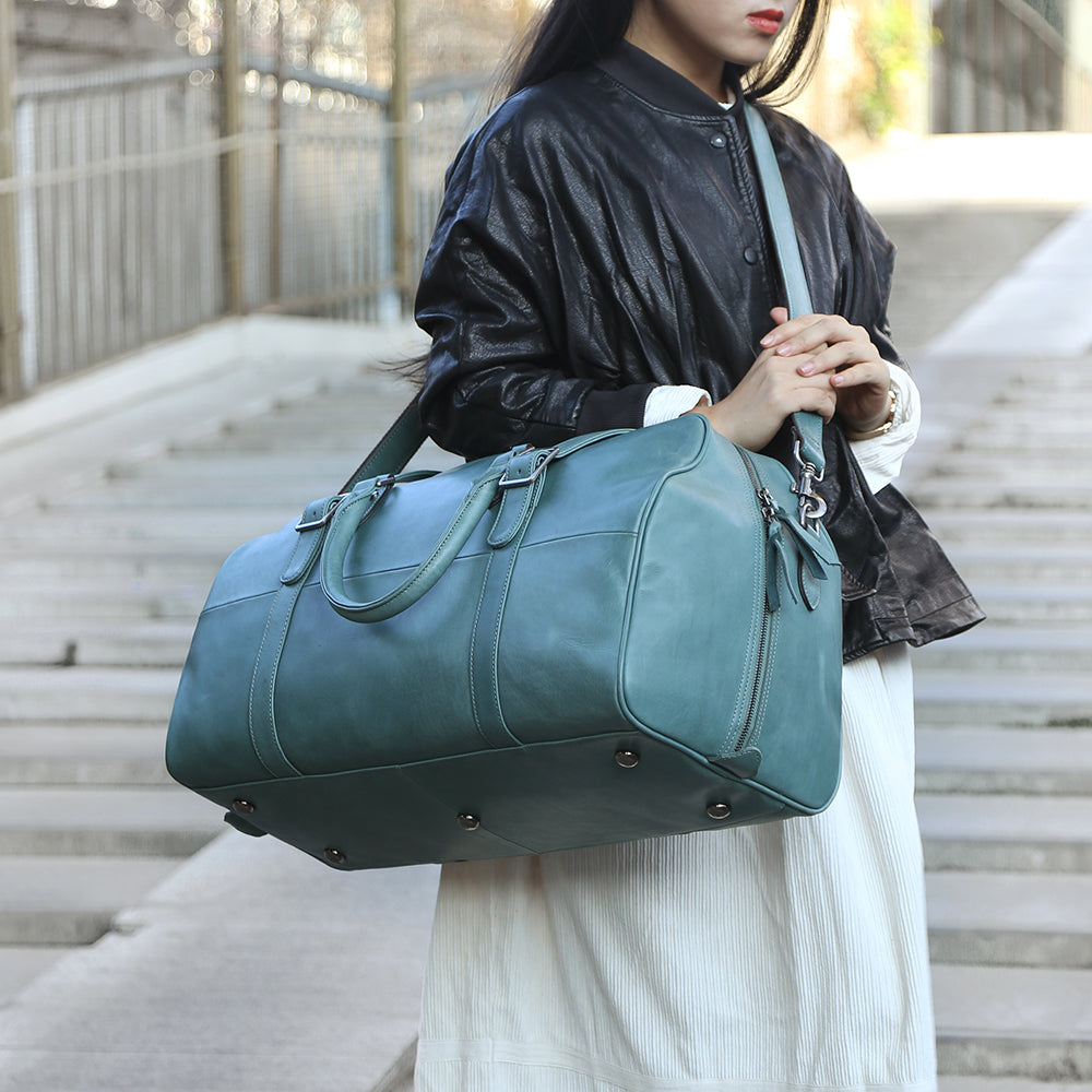 Blue leather duffle bag shop