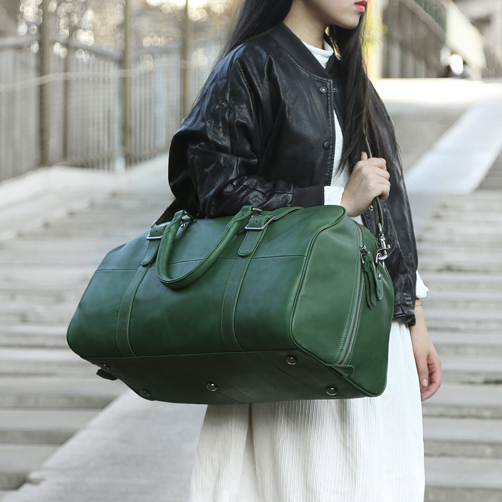 green leather duffle bag