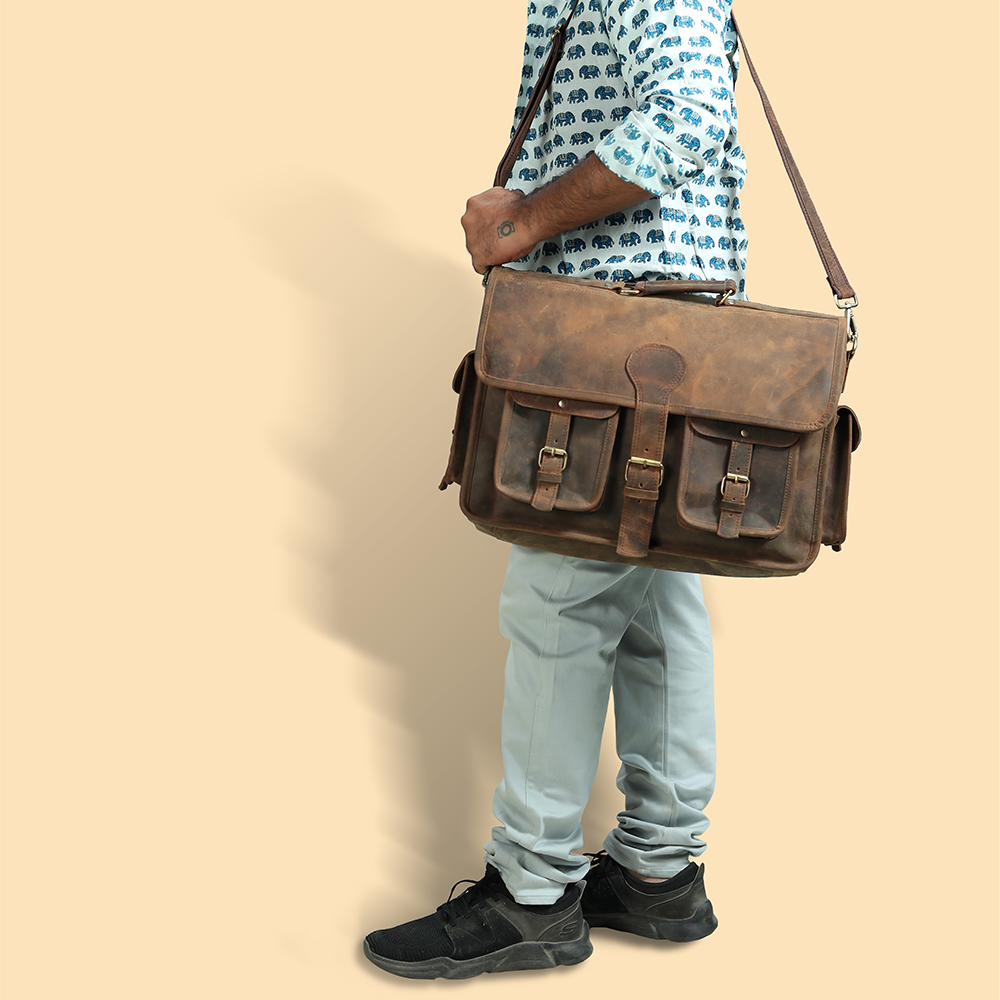A brown faux leather and fabric laptop bag, Fine Watches