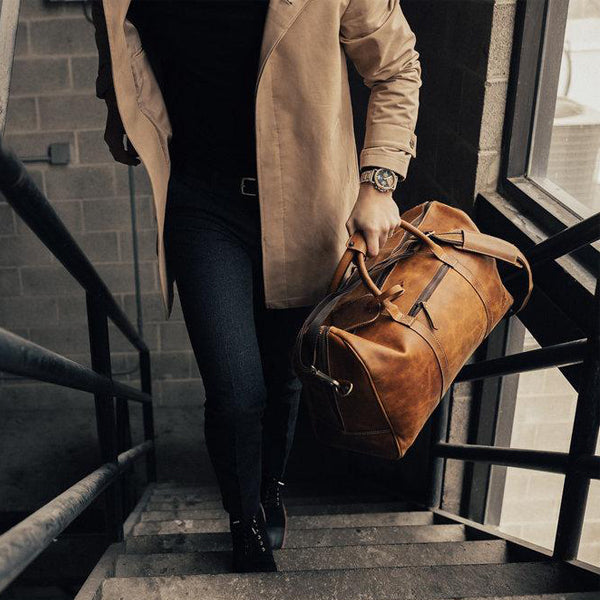 Men's Overnight Travel Leather Duffel Bag - 30L Top Grain Leather Brown coming up stairs